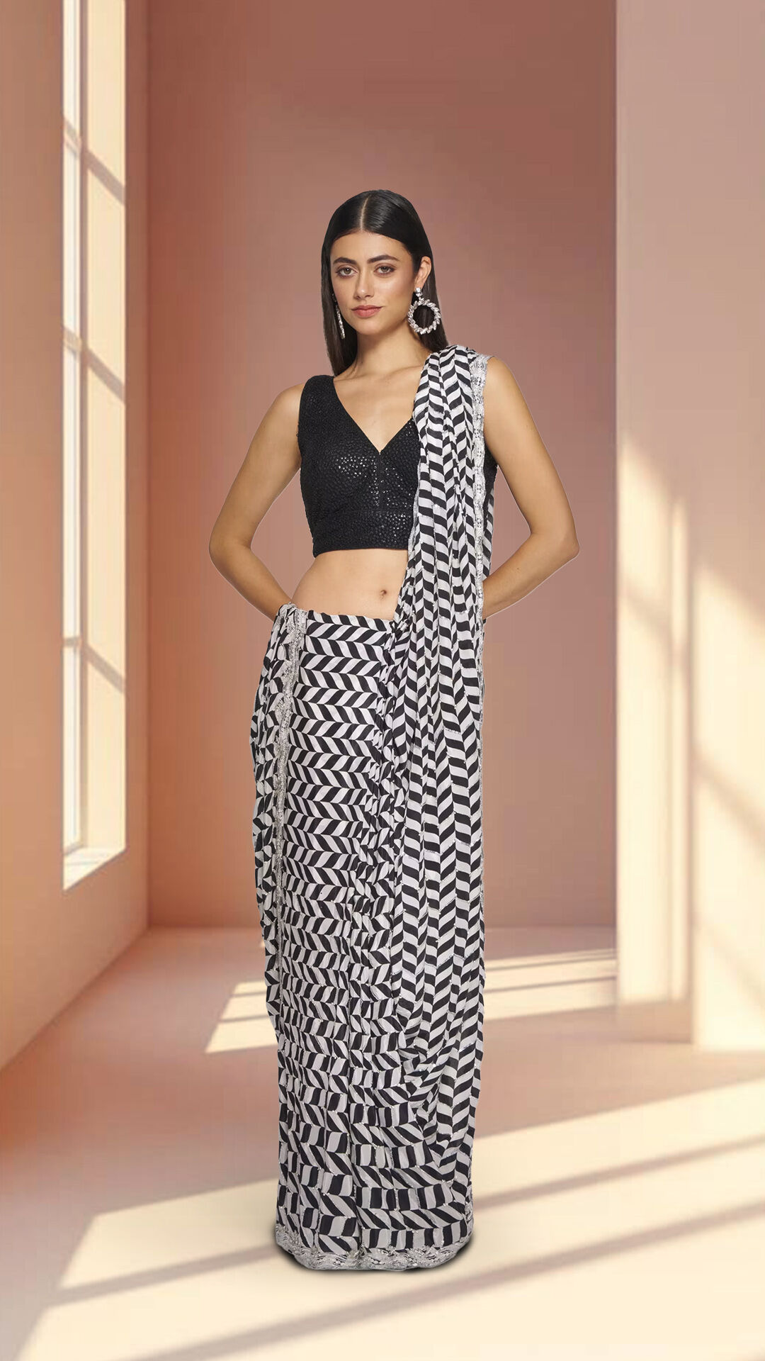 Woman wearing beautiful black patterned luxury saree for wedding celebration